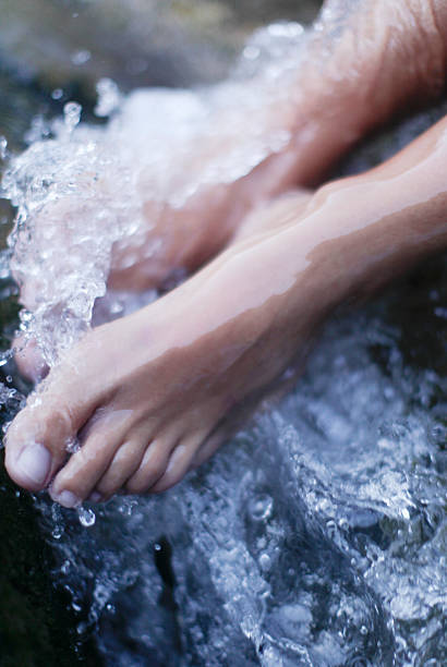 istock Spa experience foot massage with water 497515605