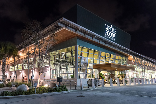 Miami, Florida, USA - October 28, 2015: North Miami's Whole Food Market Facade at night. Whole Foods is an American foods supermarket chain specializing in natural and organic foods. It opened on Sept. 20, 1980, in Austin, Texas, its current headquarters