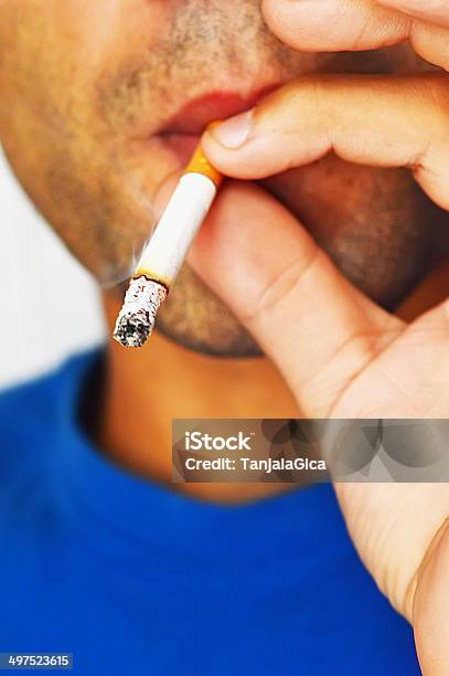 Close Up Portrait Of Young Man Smoking Cigarette Stock Photo - Download Image Now - Abuse, Addiction, Adult