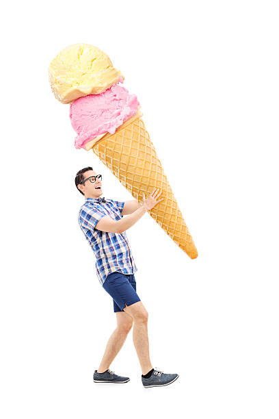 istock Cheerful young man carrying an enormous ice cream 497524729