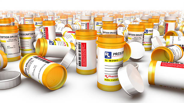 Close-up of empty pill bottles (fallen at side) stock photo