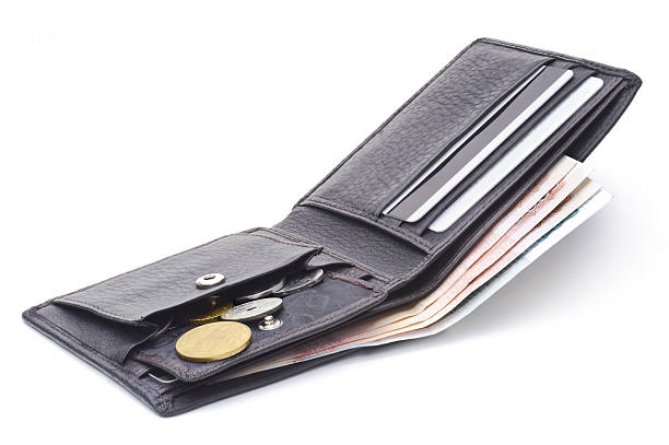 istock Open brown leather wallet with money 497526245