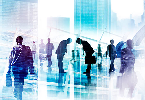 istock Businessmen Bowing with Cityscape 497526279