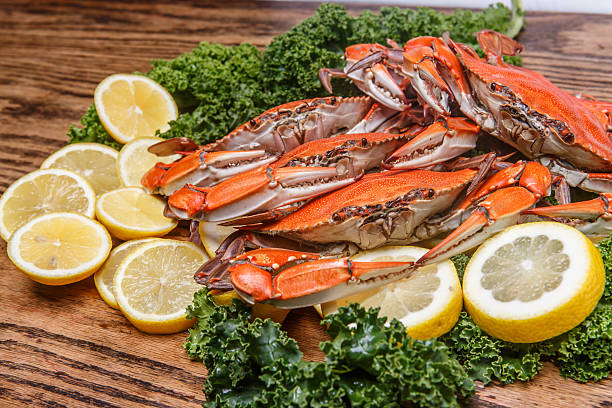 istock Steamed Blue Crabs on a wooden table 497526483