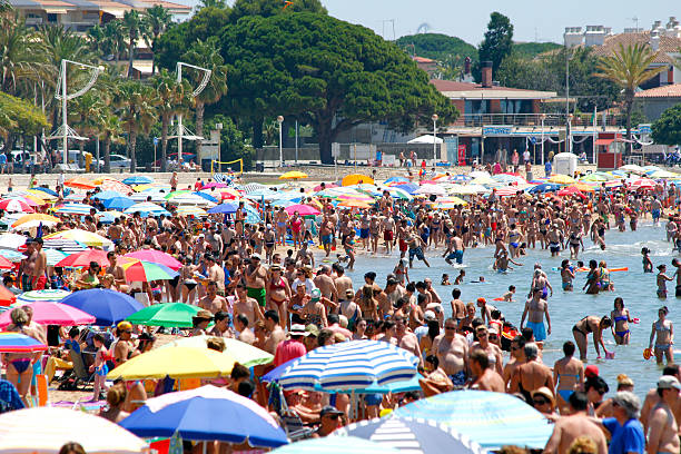 Crowded beach Crowded beach at summer, in Spain cambrils stock pictures, royalty-free photos & images
