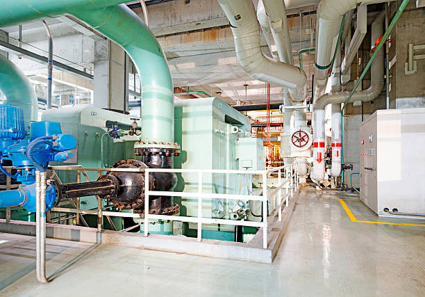 istock Equipment, cables and piping as found inside of industrial power 497528629