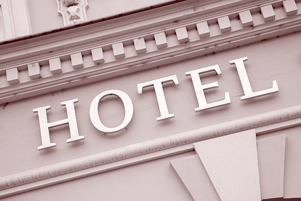 istock Gold Hotel Sign on White Wall Background 497528999