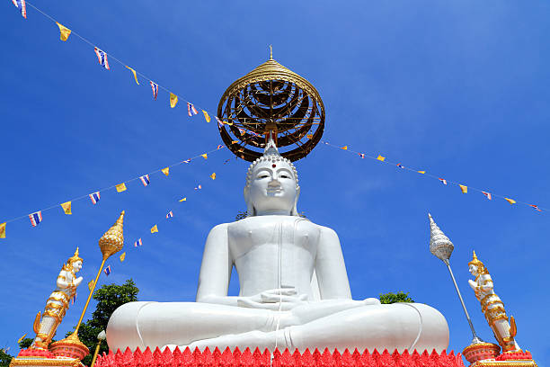 big white buddha  statue sitting  in thai  temple big white buddha  statue sitting  in thai  temple  under golden umbrella wat phananchoeng stock pictures, royalty-free photos & images