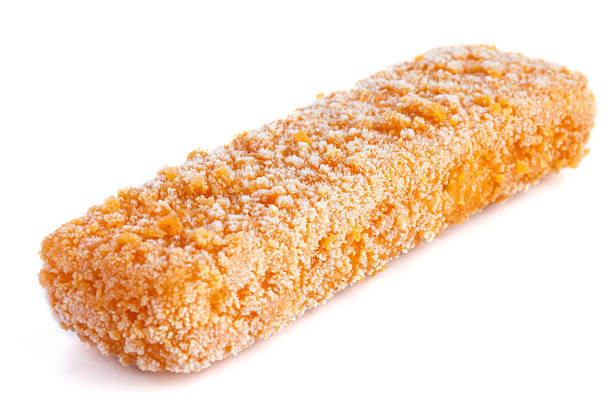 istock Frozen bread crumbed fish fingers on white. 497530503