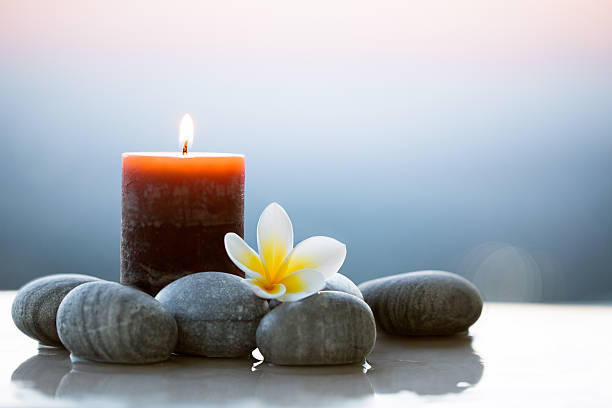 istock Plumeria flower and stones for spa background 497533582