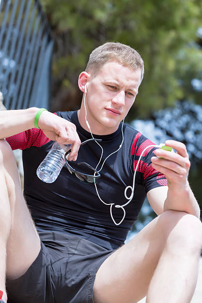 istock male runner listening music 497533926