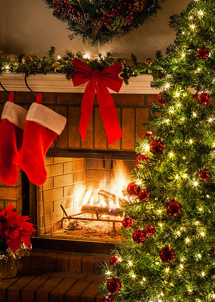 istock Christmas tree, blaziing fire, stockings, fireplace, wreath, bow 497534952