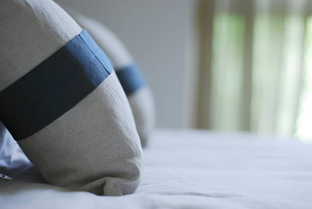 close up of pillow by the bed stock photo