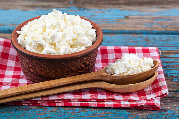 istock Fresh cottage cheese in a ceramic dish and spoon 497535880
