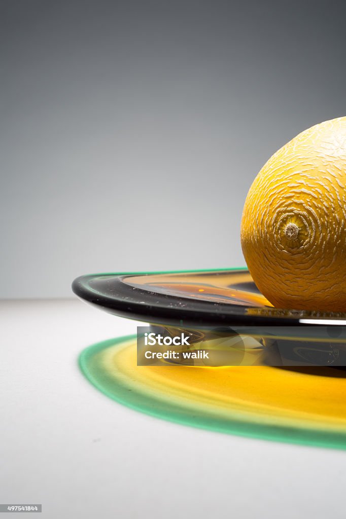 Cantaloupe melon fruit on a colourful plate Part of Cantaloupe melon fruit on a colourful plate with reflection on background. 2015 Stock Photo