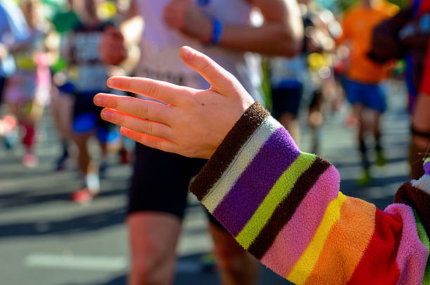 istock Marathon running race, support runners on road 497543682