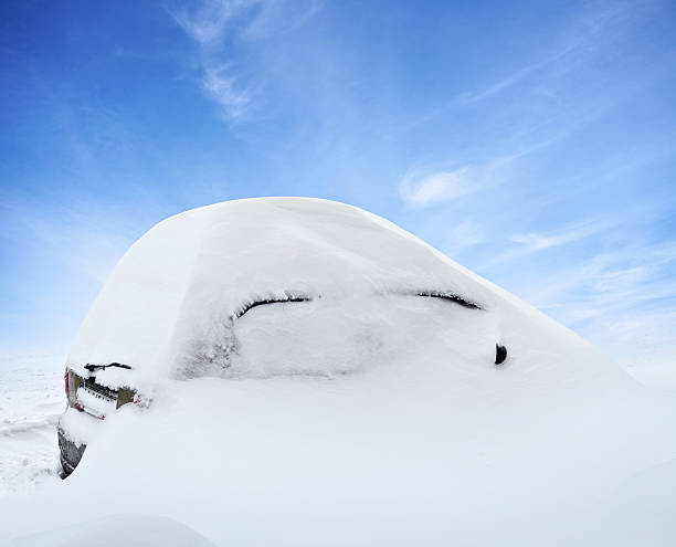 istock Car under deep snow in winter day after snowfall 497543800