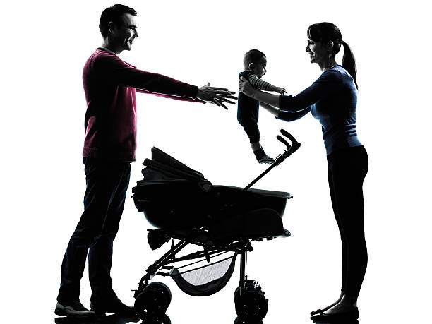 istock parents with baby silhouette 497545075
