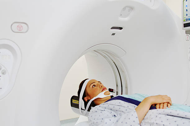 istock Patient having CAT scan of her head 497545093