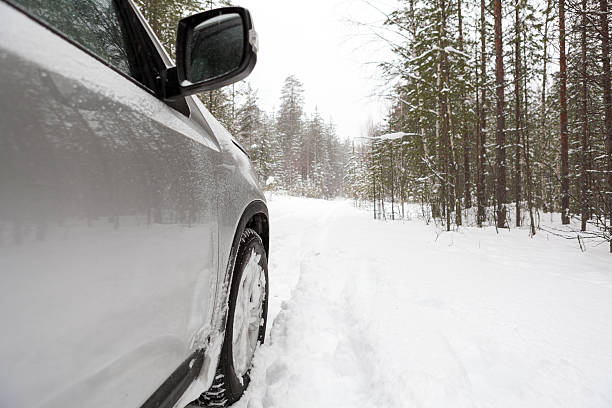 istock Offroad car standing on snowy forest road, copyspace 497545401