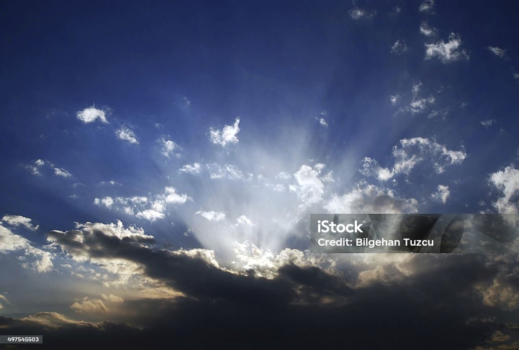 light beam Sun in blue sky with clouds. Above Stock Photo