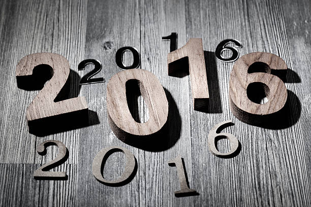 istock Happy New Year 2016 numbers wooden floor 497545616