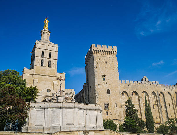 The 12th century Notre Dame des Doms cathedral showing the Palais des Papes on the right.
