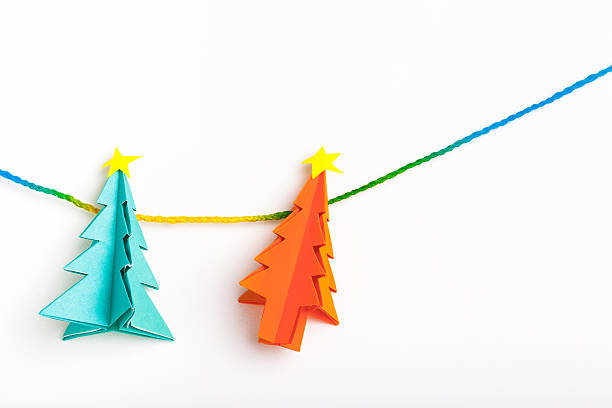 istock Christmas tree on white isolated origami. 497545748