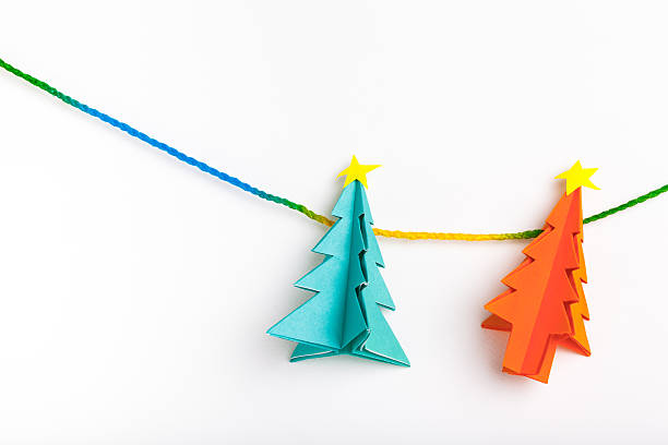 istock Christmas tree on white isolated origami. 497545806