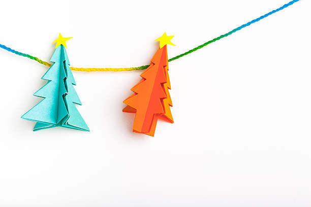 istock Christmas tree on white isolated origami. 497545856