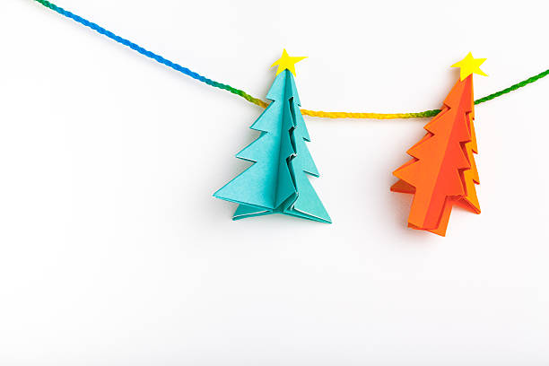 istock Christmas tree on white isolated origami. 497545940