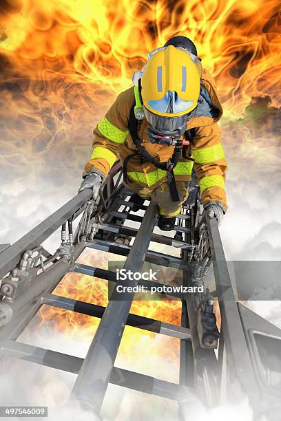 Firefighter Ascends Upon A One Hundred Foot Ladder Stock Photo - Download Image Now