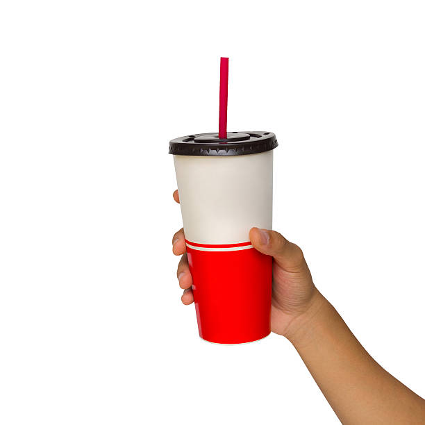 istock Holding a paper cup with tube isolated over white background 497546667