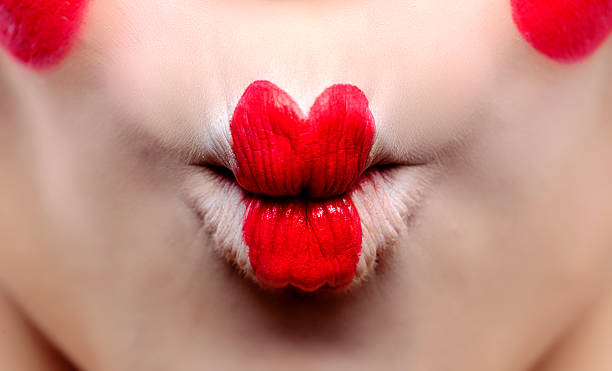 fish lips macro shot on woman lips with makeup making fish lips. fish lips stock pictures, royalty-free photos & images