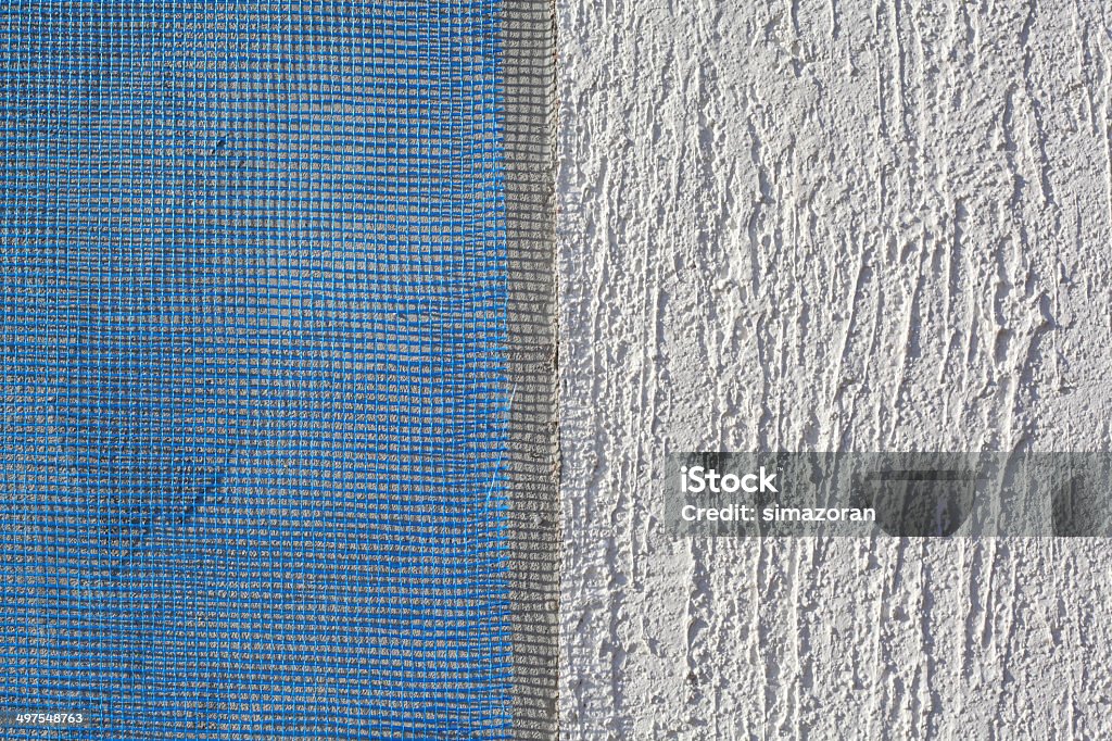 Wall insulation, mortar, plaster, mesh Closeup of layers over styrofoam insulation, mesh, plaster, cement, mortar Architecture Stock Photo