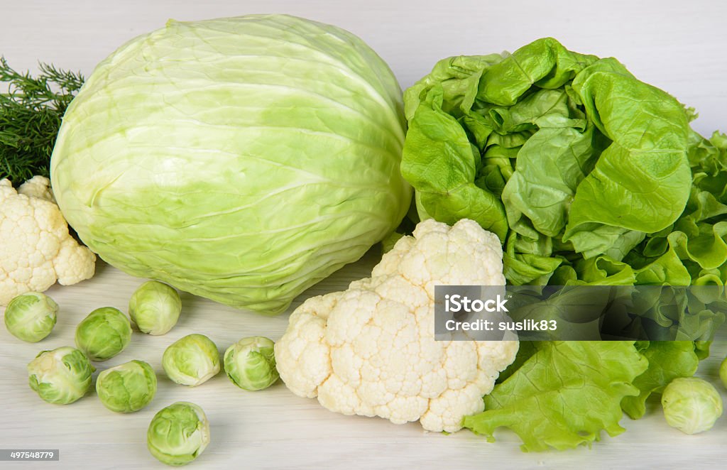 cabbages Still life with assortment cabbages on wooden background Agriculture Stock Photo