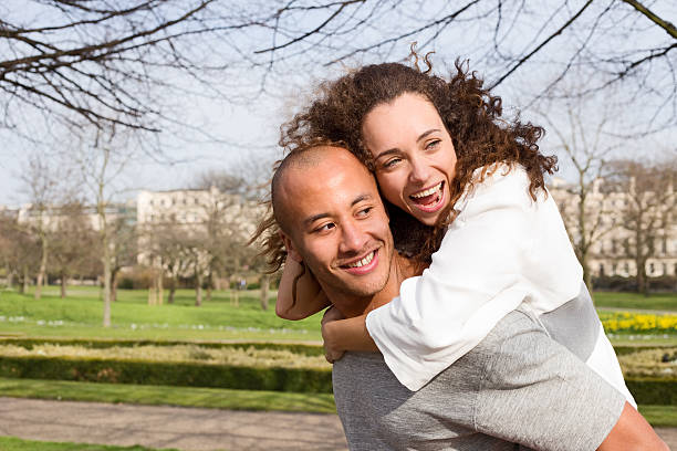 istock couple having fun in the park 497548938