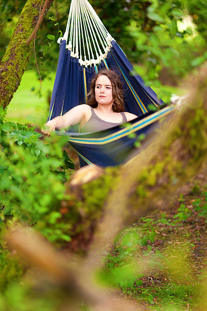 istock Girl Relaxing In A Hammock 497549583