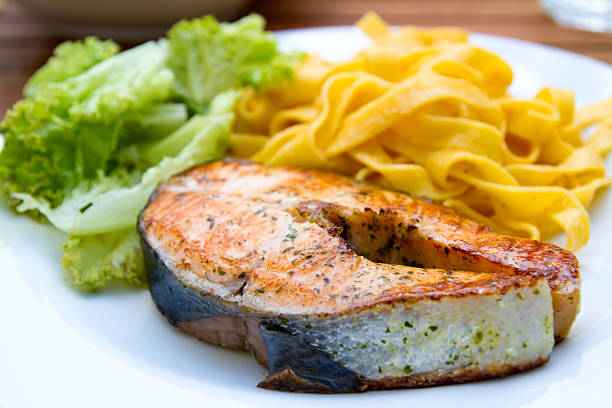 lachs mit паста salat und - plate salmon food dinner стоковые фото и изображения