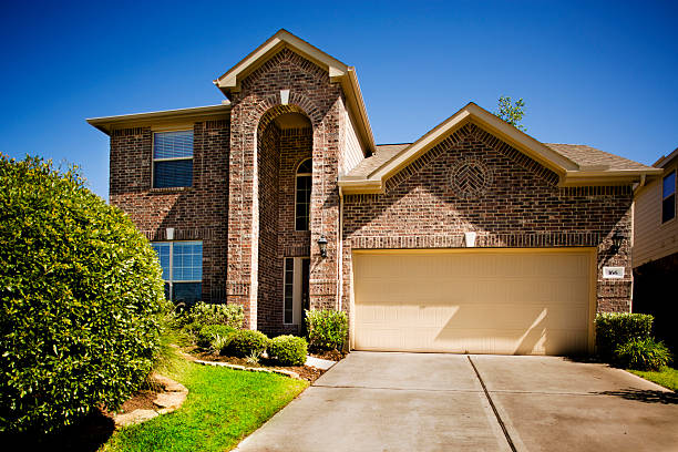 istock Modern brick home in residential neighborhood. Front yard. 497549929