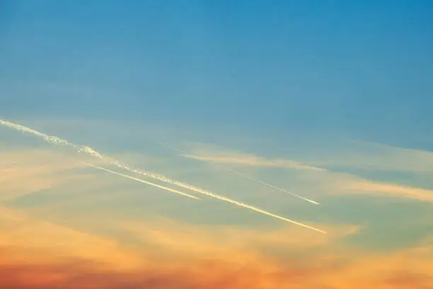 traces of plane in evening sky. cloudscape