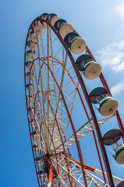 istock Underside view of a ferris wheel on sky background 497565372