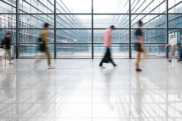 istock people silhouette in hall of office building 497565659