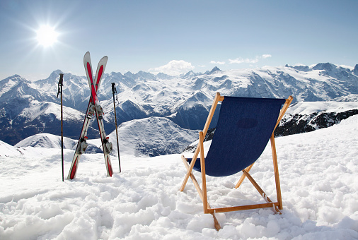 Scenic winter landscape on the top of the mountain, white snow, a rooftop of wooden hut, alps