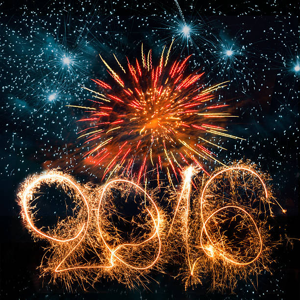istock number 2016 sparks on red blue fireworks background 497567586