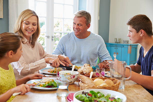 istock Family Enjoying Meal At Home Together 497567830