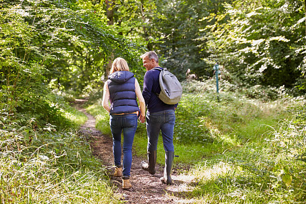 istock Mature Couple On Walk Through Beautiful Countryside 497569000