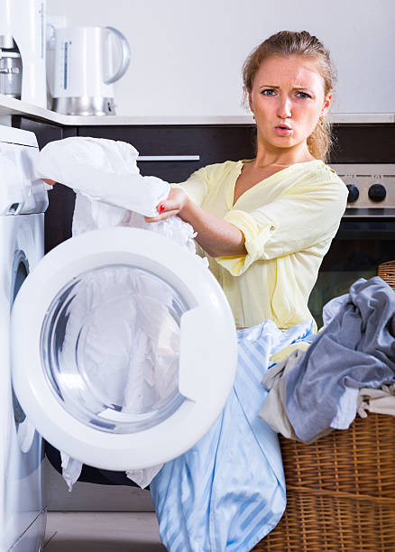 istock Young woman holding stained linen 497570378