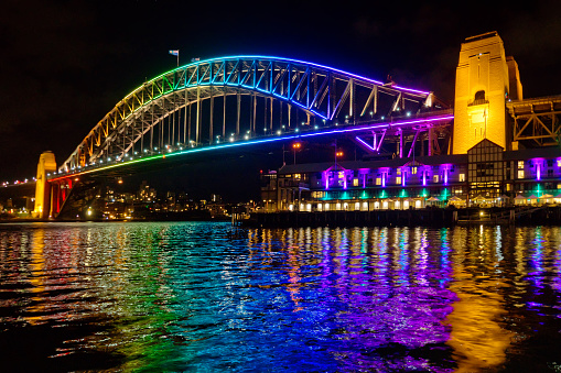 The Sydney Harbour Bridge, lit up in rainbow coloured lights for the Vivid Sydney festival.