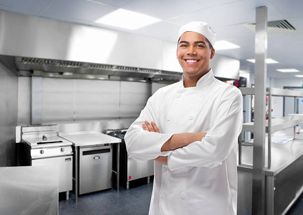 happy trainee chef in modern kitchen happy trainee chef in modern kitchen yarmulke photos stock pictures, royalty-free photos & images